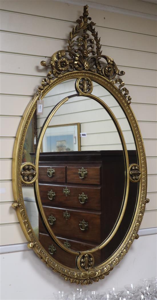 A George III style giltwood and gesso oval wall mirror, H.141cm, W.82cm